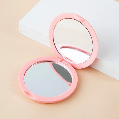 Compact Dubbelzijdige Handheld Make-up Spiegel - Vouwbare Ronde Reisessentieel voor Schoonheids- en Cosmetische Bijwerkingen