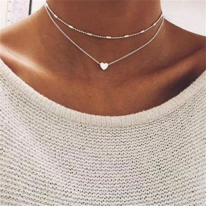 Elegante Dubbel Laags Parels Choker Ketting met Hart Bedel - Perfect Sieraden Geschenk voor Vrouwen