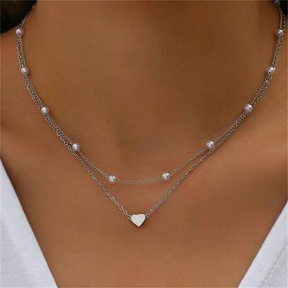 Elegante Dubbel Laags Parels Choker Ketting met Hart Bedel - Perfect Sieraden Geschenk voor Vrouwen