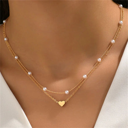 Elegante Dubbel Laags Parels Choker Ketting met Hart Bedel - Perfect Sieraden Geschenk voor Vrouwen